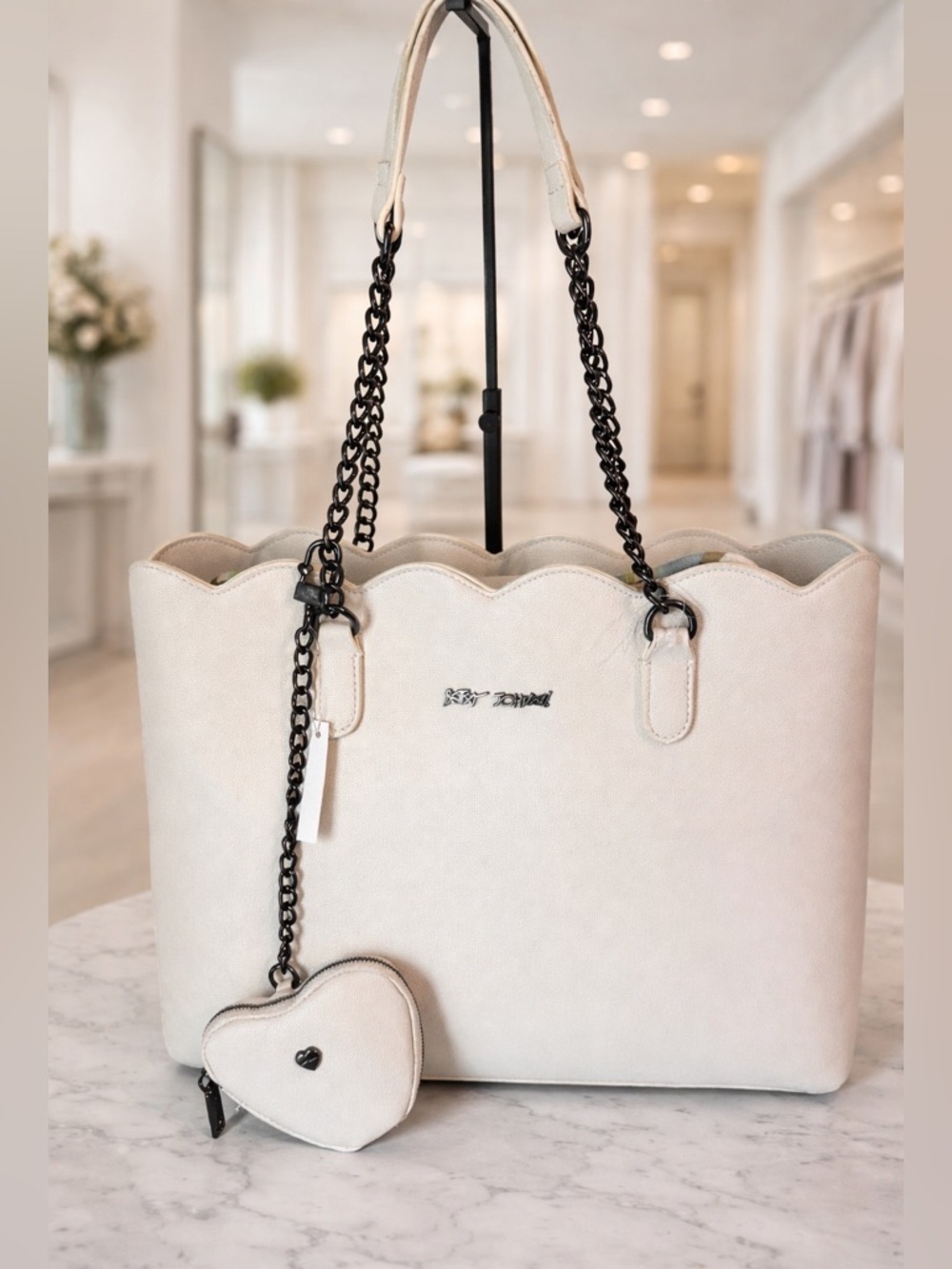 Betsey Johnson cream-colored tote bag black chain straps and heart-shaped charm